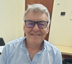 Associate Professor Groves wearing glasses.